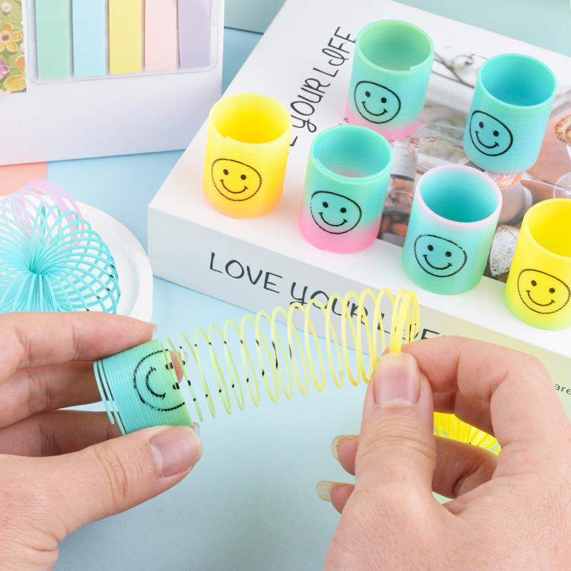Kids' Colorful Smiling Rainbow Coil Toy - Elastic Spiral with Seven Colors for Street Stall Prizes