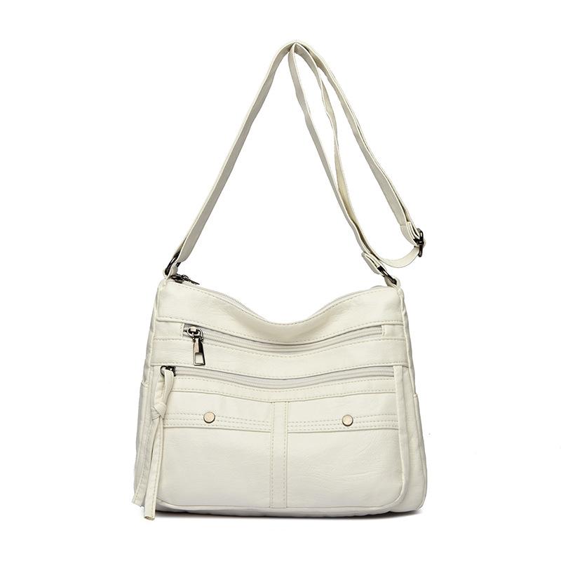 

Эта одноплечевая сумка кроссбоди модная и ретро. Это универсальная сумка через плечо для ежедневных поездок на работу и путешествий белый