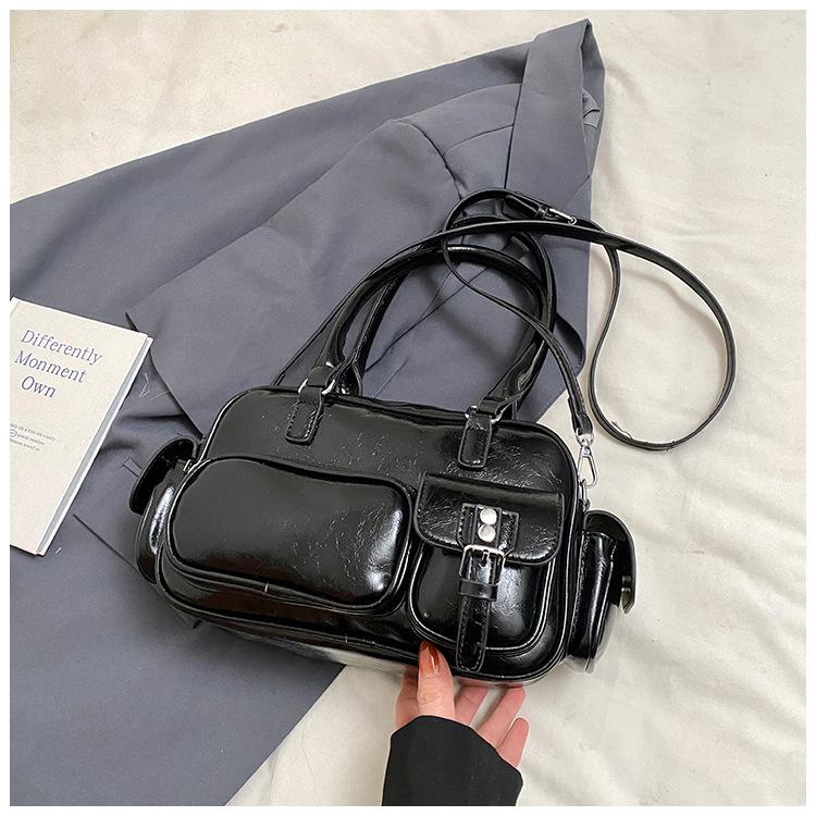 

Горячая новинка, модная нишевая портативная сумка для боулинга, женская текстурная универсальная сумка через плечо для通勤 однотонная