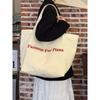 Korean large-capacity canvas bag women's new ins style letter shoulder bag casual versatile commuter tote bag
