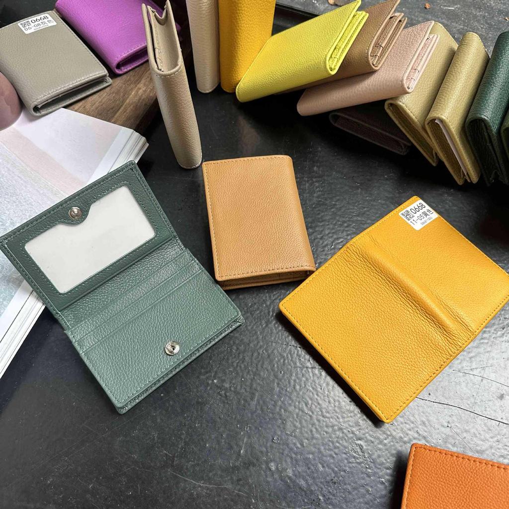 Premium Leather Card Holder: Unisex Cowhide Business Case with Mirror Window, Snap Closure & Coin Purse.