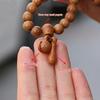 Mindful Peach Wood Fish Beads Bracelet with Carved Wooden Pendant