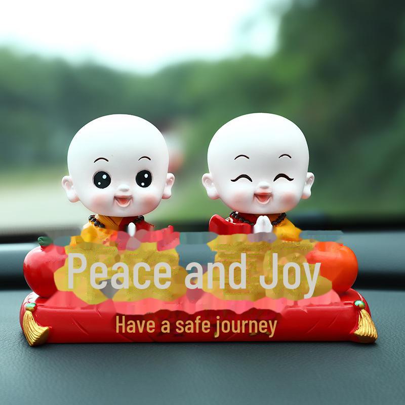 Creative Little Monk Maitreya Buddha Car Ornament: Cute, Shaking Head Resin Doll for Car Interior Decoration and Safety.