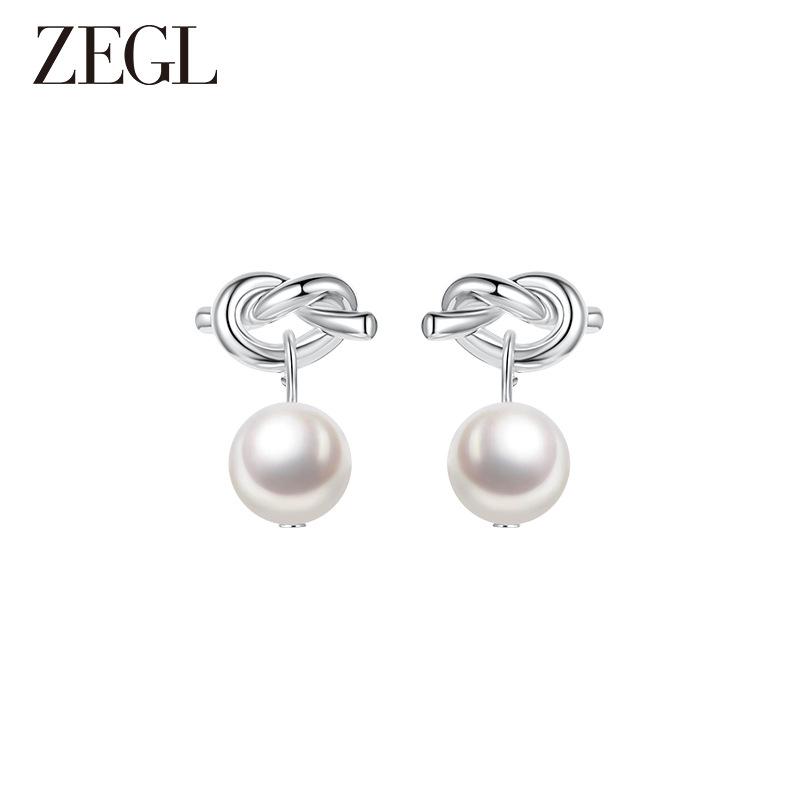 

Retro artificial pearl earrings women s new popular stud earrings temperament light luxury silver needle unique earrings