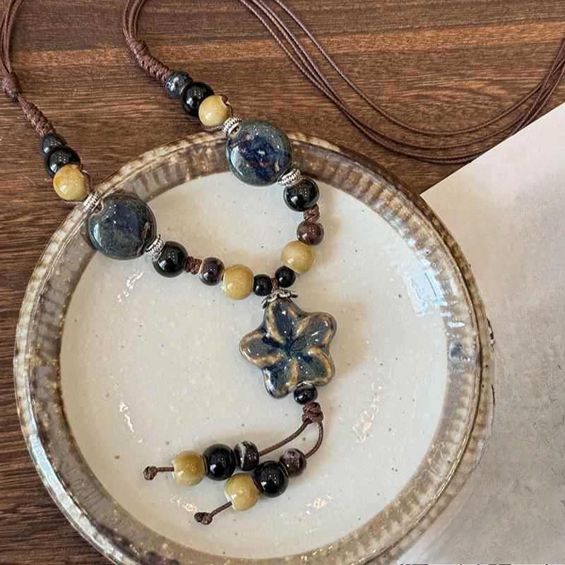 Long fringed ceramic flower necklace, retro high-end ethnic style beaded sweater chain