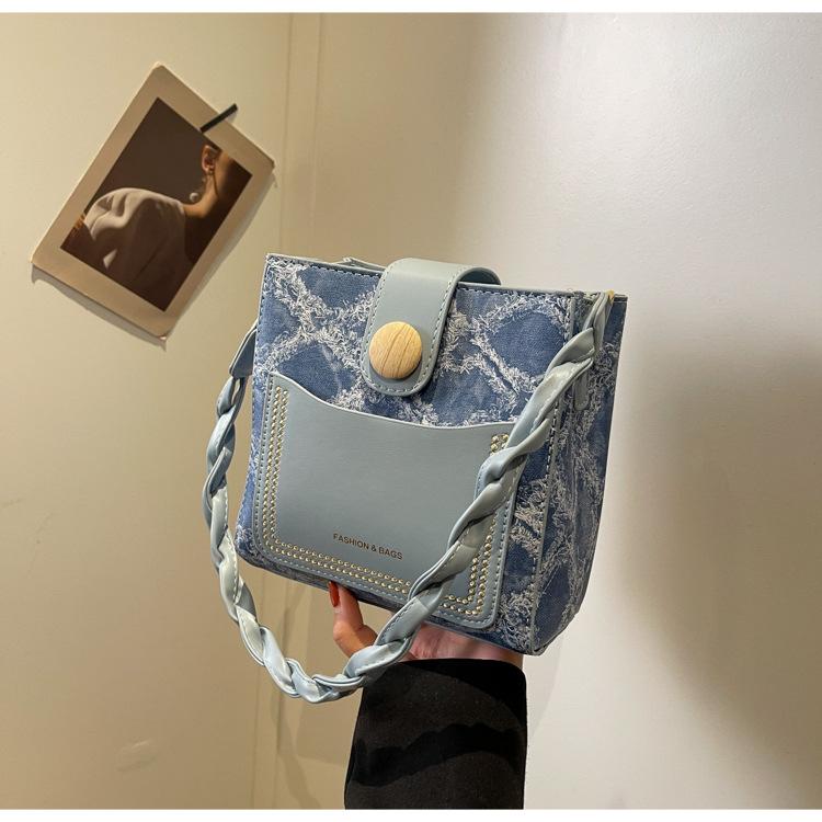 

This year s popular bag women s Korean version fashion contrasting color retro bucket bag 2024 new high-end shoulder messenger bag синій