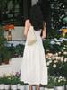 2026 summer new French V-neck white suspender dress women's waist design sense niche temperament small skirt