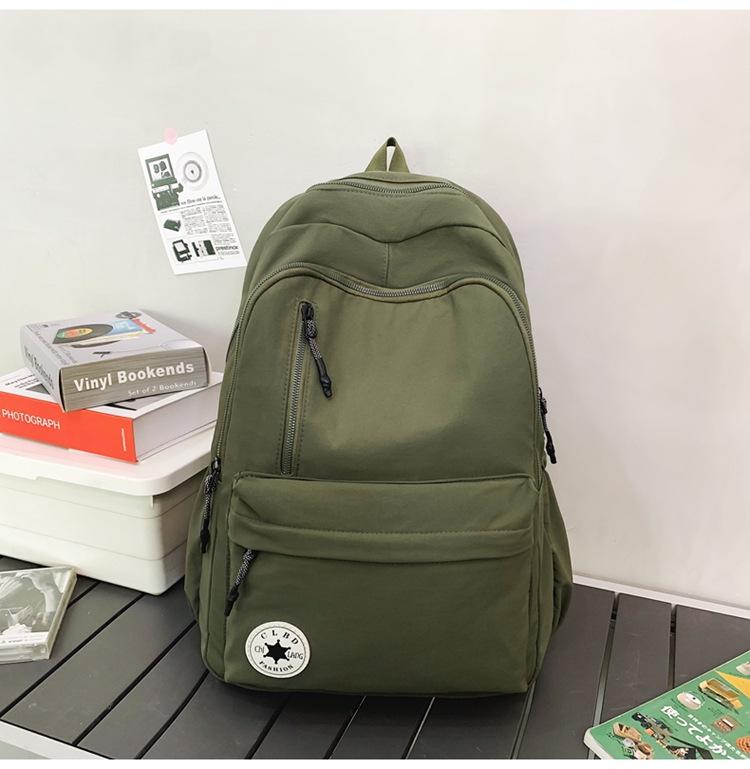 Niche Lightweight Nylon Backpack: Large-Capacity, Casual, Unisex Shoulder Bag for Commuters and Students