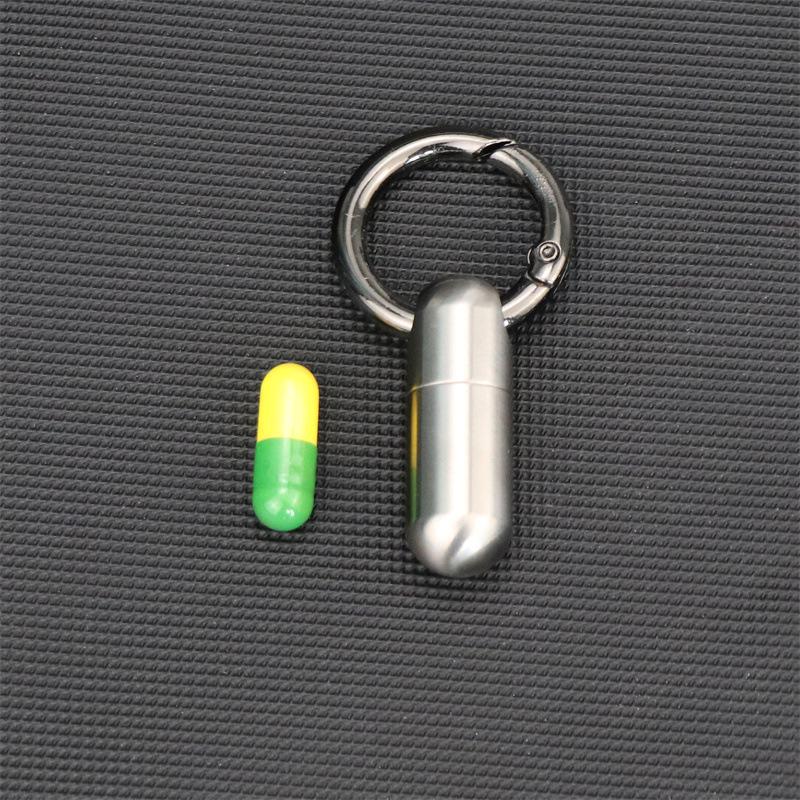 Kompakte wasserdichte Titan-Pillendose: Feuchtigkeitsdichte Mini-Medizinkapsel aus Edelstahl.