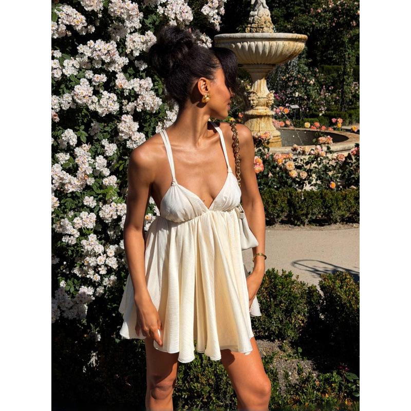 INS European and American women's clothing summer new V-neck hollow backless seaside vacation wind loose suspender dress women