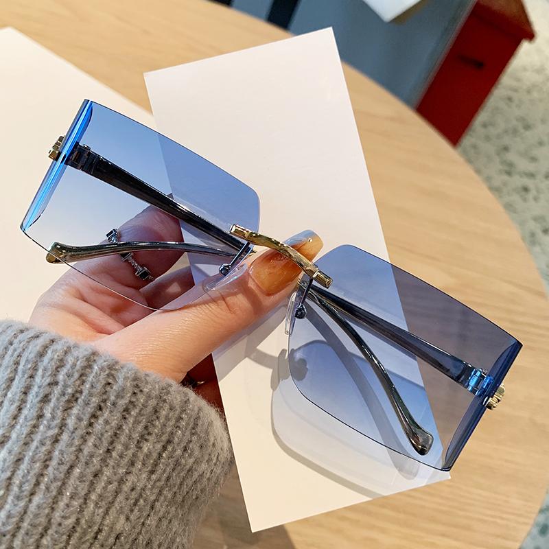 

Women s Sun shades Frameless Edge Cut Sun shades Stylish Leopard Head Metal Eyewear High-end Curved Sun shades 90299