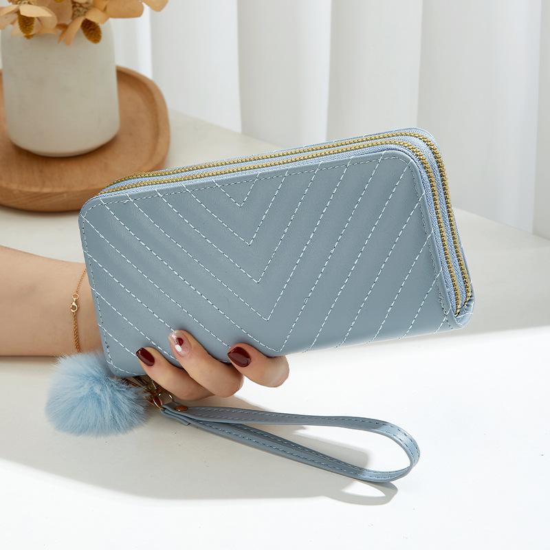 Women's long double-layer wallet, new oblique pattern embroidery hairball decoration, hand-held change bag, casual bag, one generation