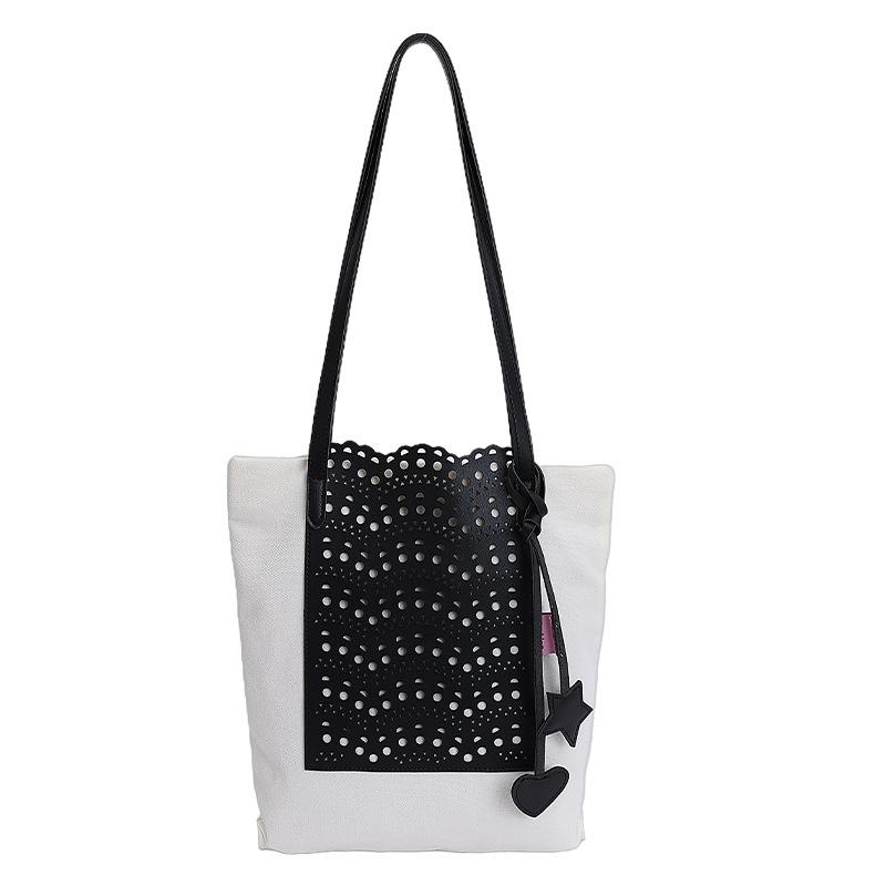 

Korean simple niche bucket bag hollow woven shoulder commuter women s new fashionable large-capacity temperament messenger bag