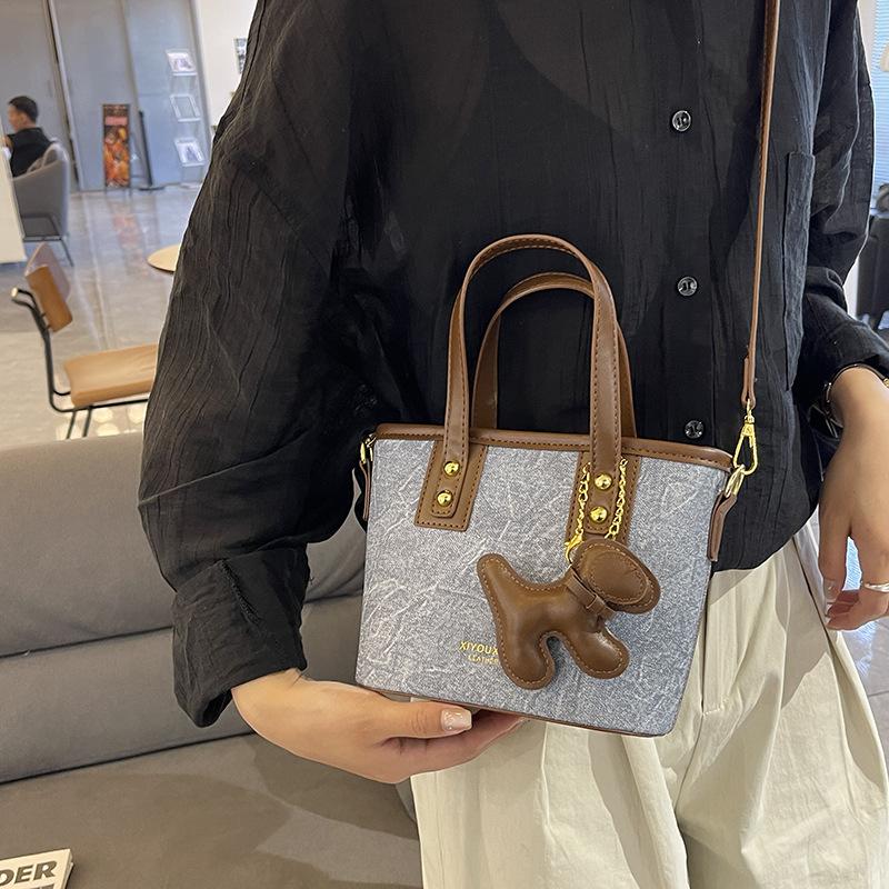 Simple Handbag Bag Women's High-end Sense Versatile Single Shoulder Oblique Span Bag Niche Design Commuter Bucket Bag