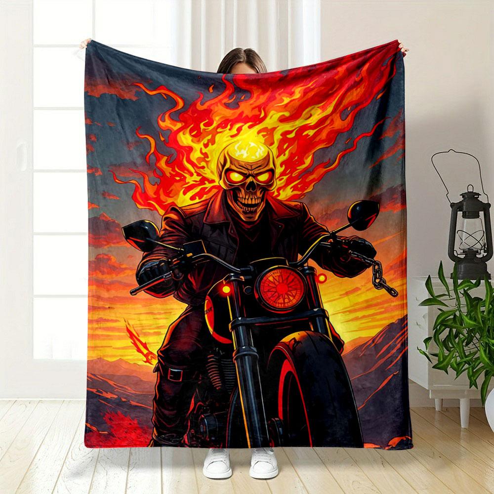 A fiery figure rides a motorcycle, surrounded by vivid flames and sunset. for all seasons blanket lunch break throw gift