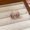 Silver Needle Leopard Print Diamond Tassel Earrings with Retro Ethnic Style and Unique Design.