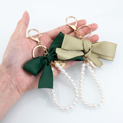 1 pièce 2 pièces Tissus Colorés Pendentif Nœud Charms Téléphone Chaîne Perle Imitée Porte-clés Lanière Sac Téléphone Portable Bijoux