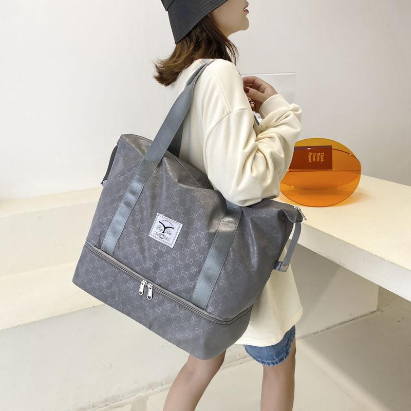 

New travel bag business travel storage bag yoga fitness bag boarding housing bag accommodation bag swimming bag світло-сірого кольору