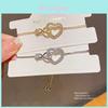 Heart Shaped Hand Chain With Zircon Stones And Gold Finish For Elegant Women