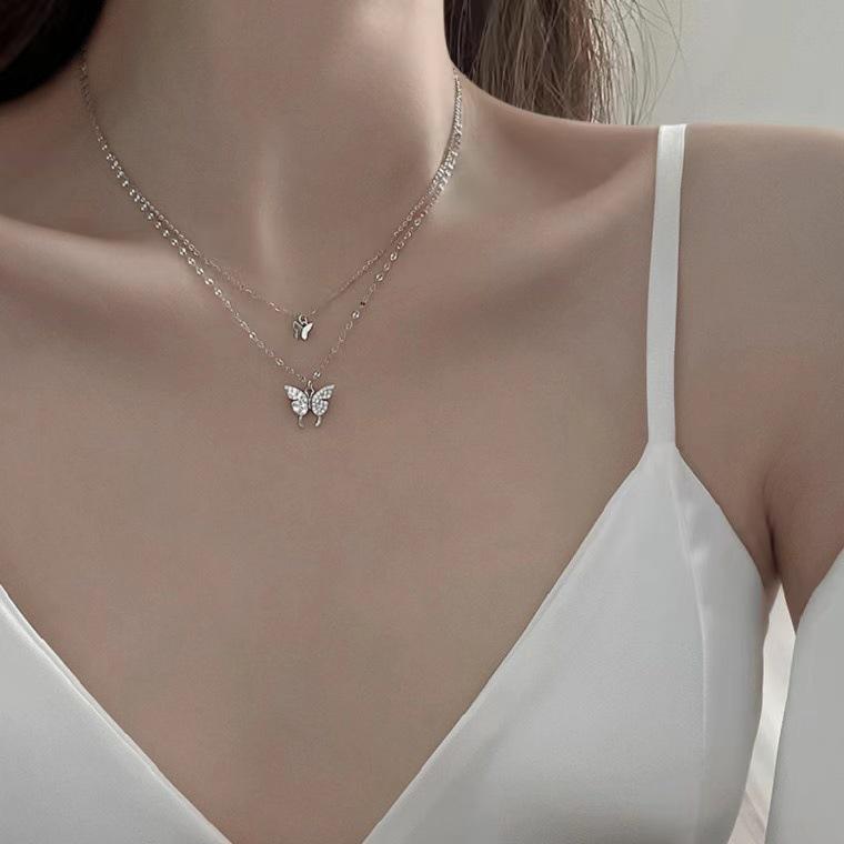 Double Layer Butterfly Necklace: Women's Light Luxury Collarbone Chain, Trendy Niche Design Pendant for 2025.