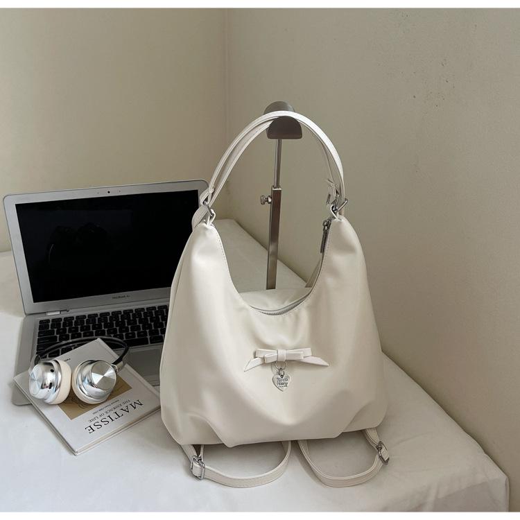 

Жіночий модний багатофункціональний рюкзак-сумка з текстурою у вигляді банта 2025