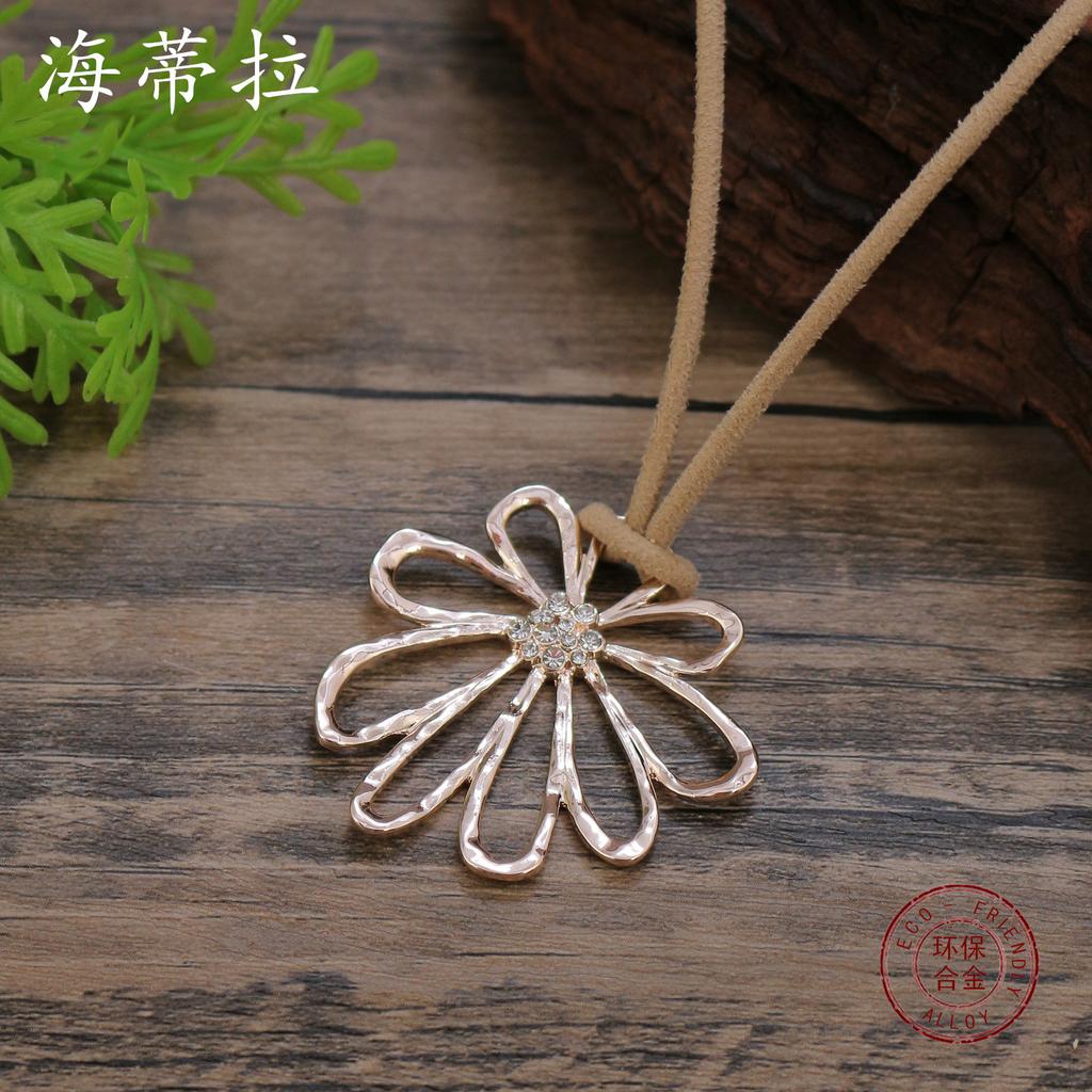 New hollow geometric point diamond flower pendant, women's retro high-end hand-woven flower pendant