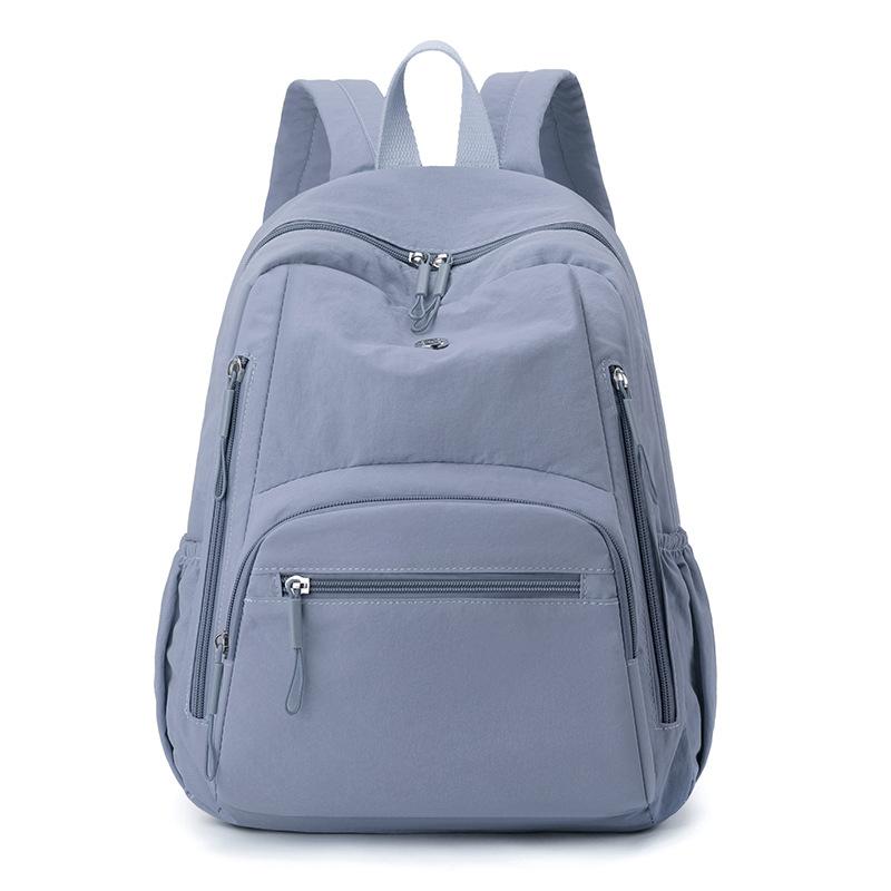 High-value solid color Korean version of the new popular simple fashion versatile light Japanese commuting travel backpack women