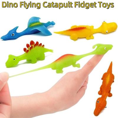 Giocattoli Catapulta Dita Dinosauro Colorati Gadget per Feste Dinosauro Gommoso Volante Catapulta Giocattoli Fidget per Bambini Regali per Feste di Compleanno