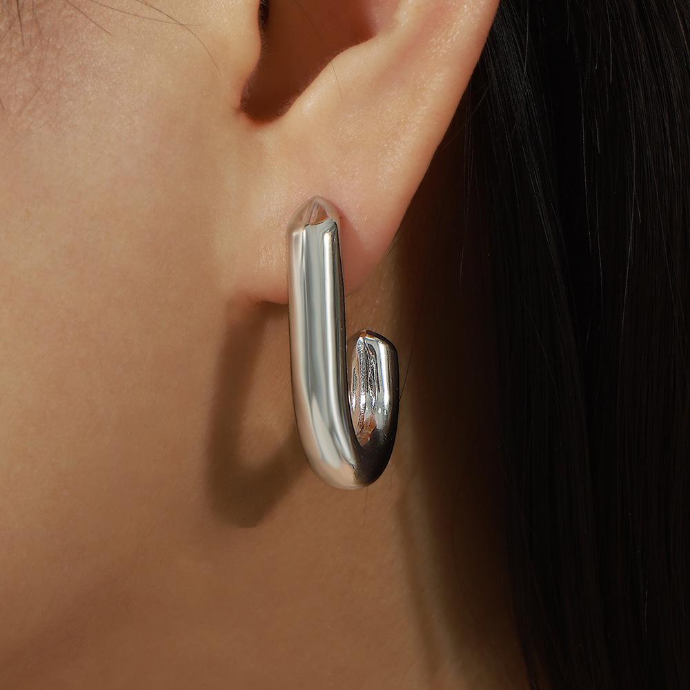 European & American Style Gold Plated J-Shaped Titanium Steel Earrings – Smooth, Versatile Studs for Women in Fashionable, Influencer-driven Design.