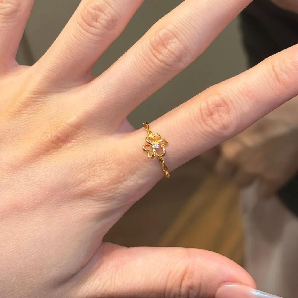 Xiaohongshu Chic Hollow Flower Bud Ring with Rhinestones - Elegant, Delicate, and Stylish Gold Accessory.