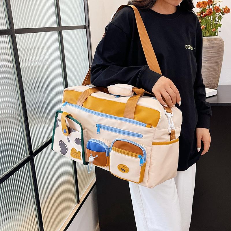 New fashion fitness bag women's large-capacity student dormitory luggage storage bag dry and wet separation cover tie rod travel bag