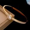 Stainless Steel Zircon Round Buckle Bangle: Luxury Fashion Bracelet for Versatile Wear.