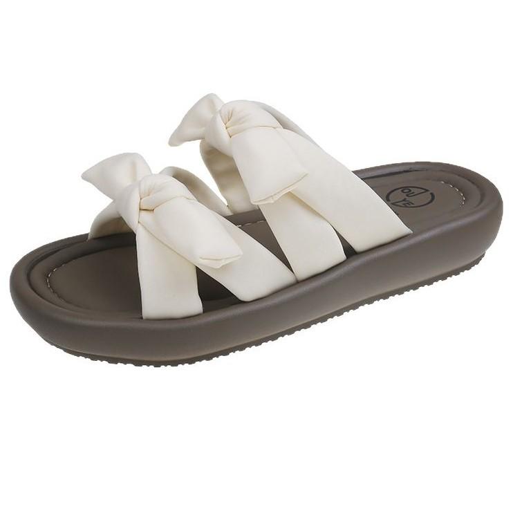 Fairy wind bow stepping on shit feeling wearing cool slippers in the summer of 2025 new versatile flat-bottomed beach one-word drag