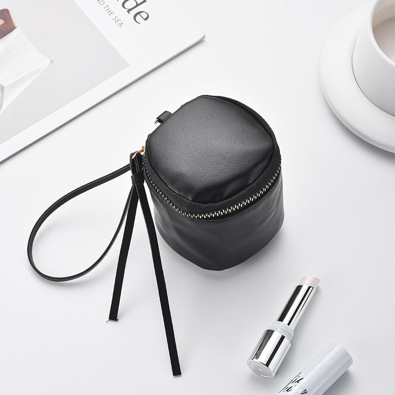 Retro Handheld Coin Purse with Wenge Beads, Flocked Leather Mini Key Holder, and Large Capacity Earphone Pocket Envelope.