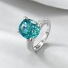 Xiancan Jewelry S925 Silver Oval Paraiba Ice Flower Cut Ring with High Carbon Diamond.