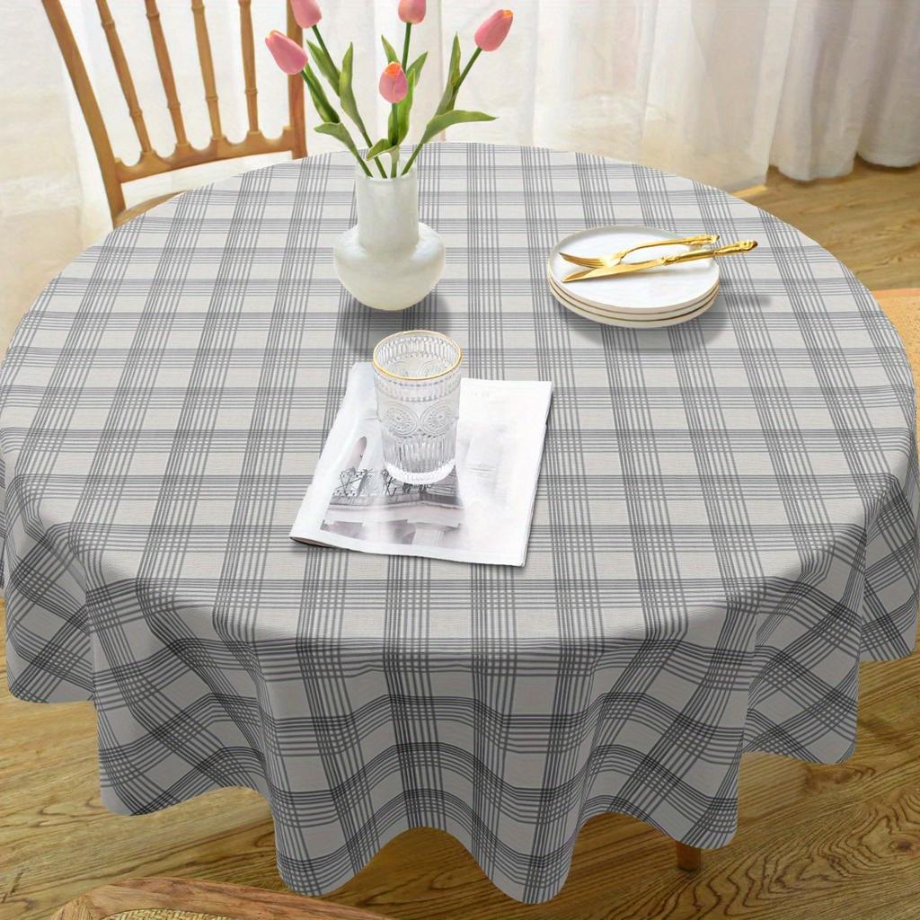 One elegant black and white checkered tablecloth, highly suitable for both indoor and outdoor usezyc