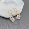 1 Pair of Luxurious Golden-Tone Swan Dangle Earrings with Sparkling Rhinestones - Elegant Zinc Alloy Fashion Jewelry for Women