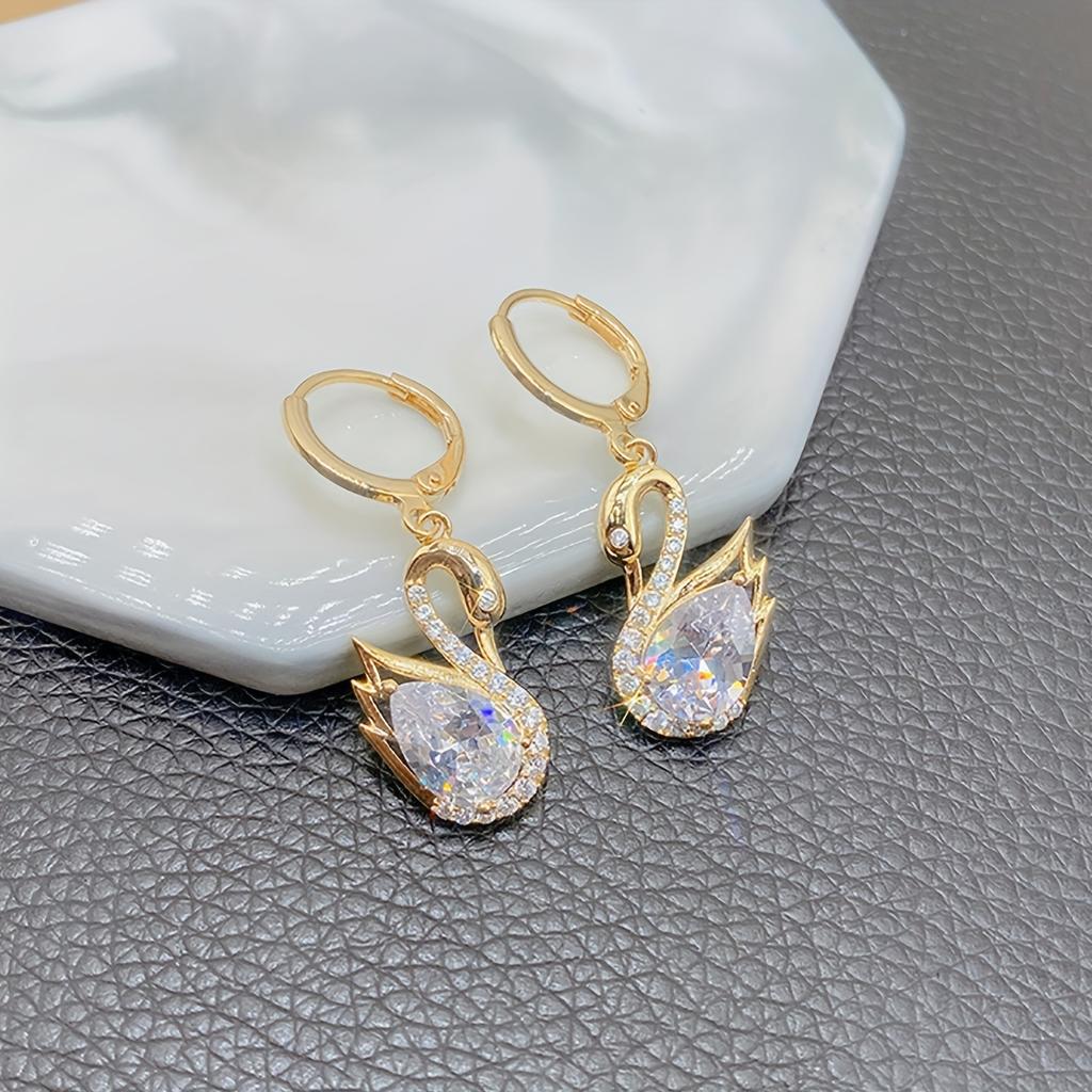 1 Pair of Luxurious Golden-Tone Swan Dangle Earrings with Sparkling Rhinestones - Elegant Zinc Alloy Fashion Jewelry for Women