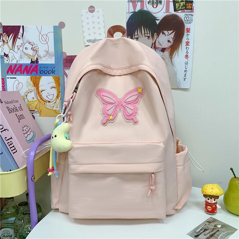 

Spring and summer new student cute backpack women s fashion simple printing butterfly junior high school large-capacity schoolbag women single bag розовый