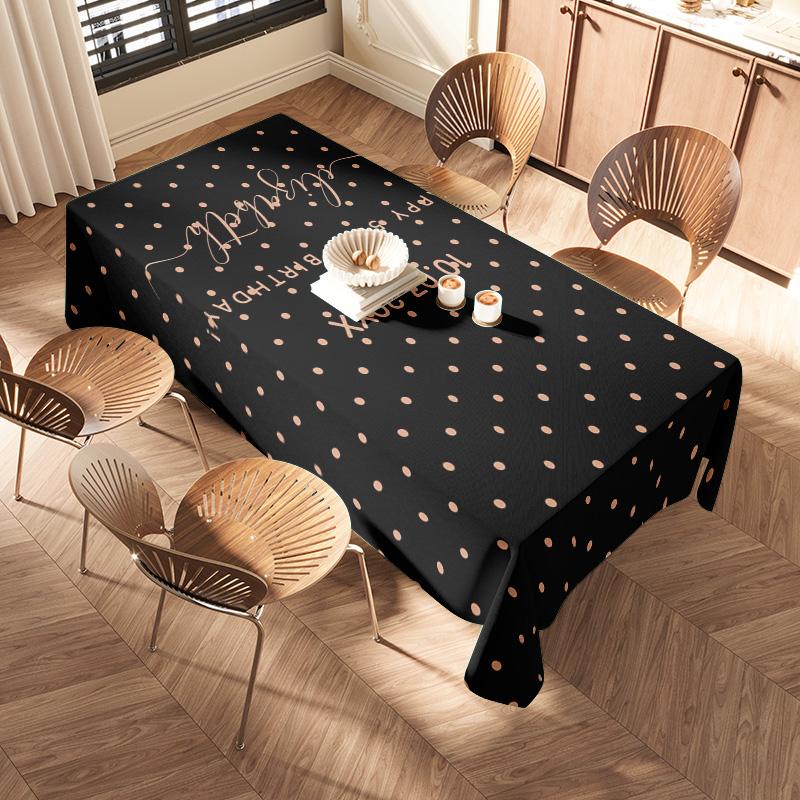 Modern Polka Dot Tablecloth: Perfect for Celebrations - This stylish table cloth features a chic polka dot pattern in bold black