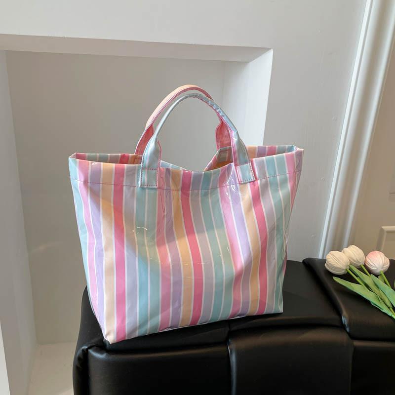 This Water-Resistant Pvc Tote Bag Features A Pink And Blue Striped Design, A Large Capacity, And Is Suitable For Beach Shopping,