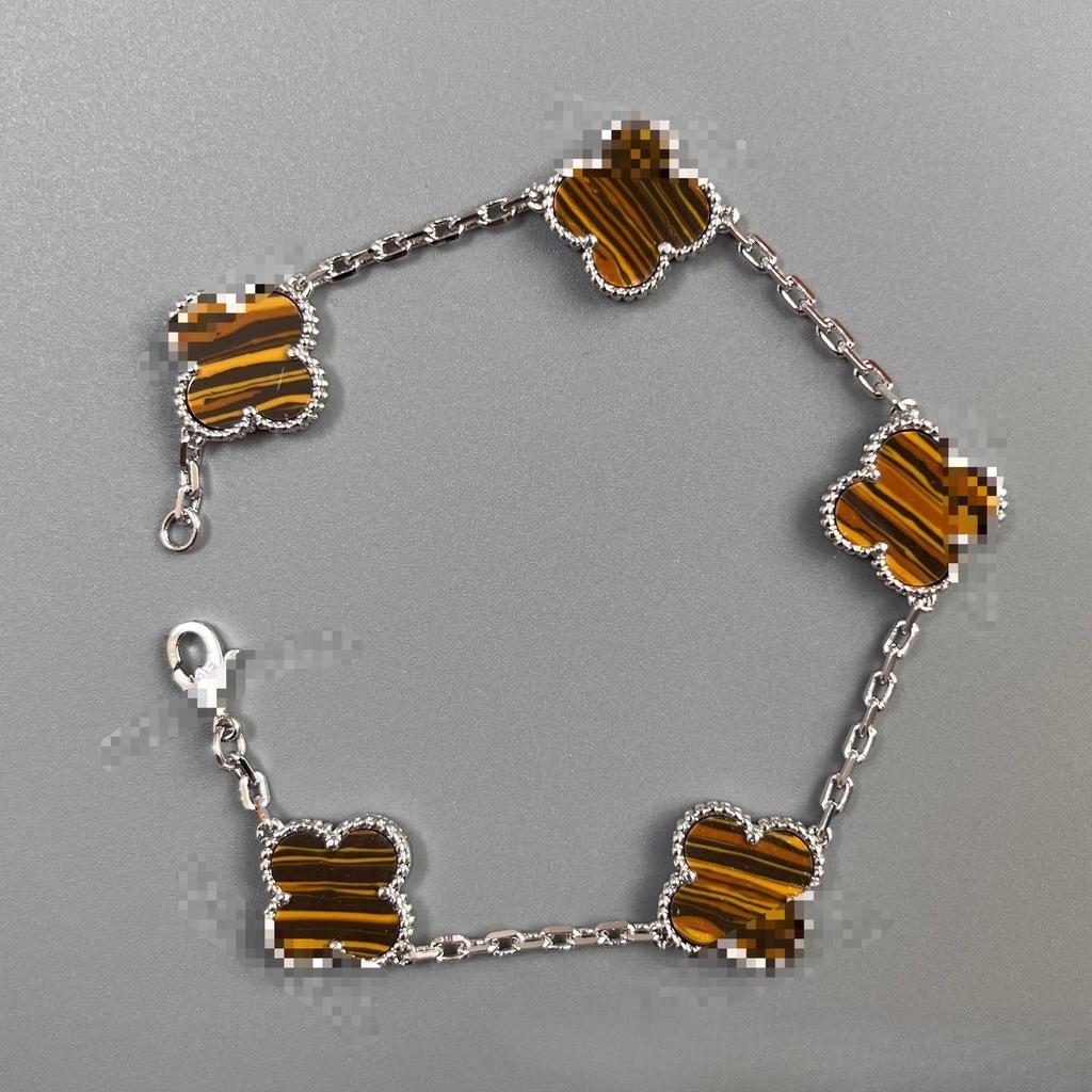 Brățară de damă din aur de 18k cu trifoi cu patru foi din sidef dublu față