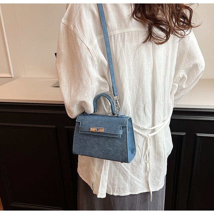 Letošní populární niche ruční taška Kelly Dámská nová retro vysoce kvalitní textura Jednoramenná crossbody taška