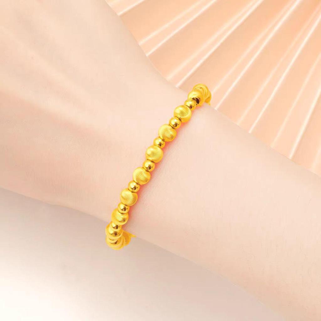 Katzenaugen-Rundperlen-Armband: Vietnamesische Sandgold-Kordel mit Gold im Antikstil und Glücksperlen – Hochwertiger Modeschmuck.