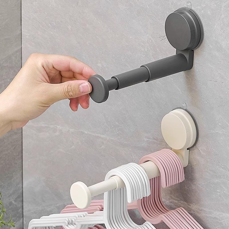 Retractable Wall-Mounted Clothes Rack: Multi-Functional, Seamless, No Punching, with Suction Cup Hangers for Balcony Storage