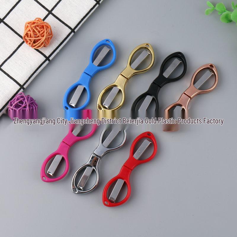 Rose Gold 8-Shaped Stainless Steel Folding Travel Scissors - Portable and Compact for Fishing and Eyeglass Needs.