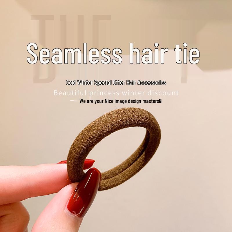 Seamless Black Rubber Hair Tie for Women - High Elasticity, Durable, and Hair-Friendly Hair Accessory.