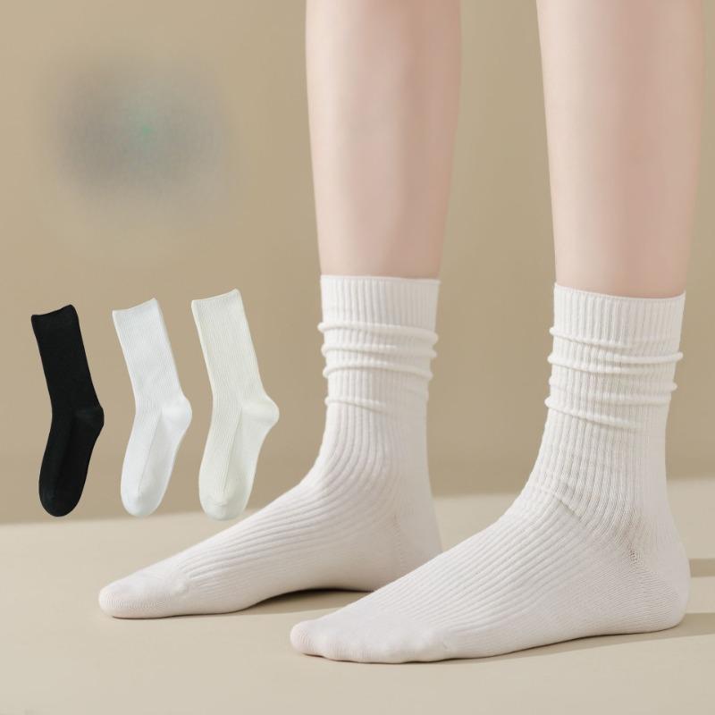 For Women, There Are Boneless and Non-uncomfortable Mid-calf Socks. Pull A Solid-colored Cotton Long Calf Sock That Is Breathable