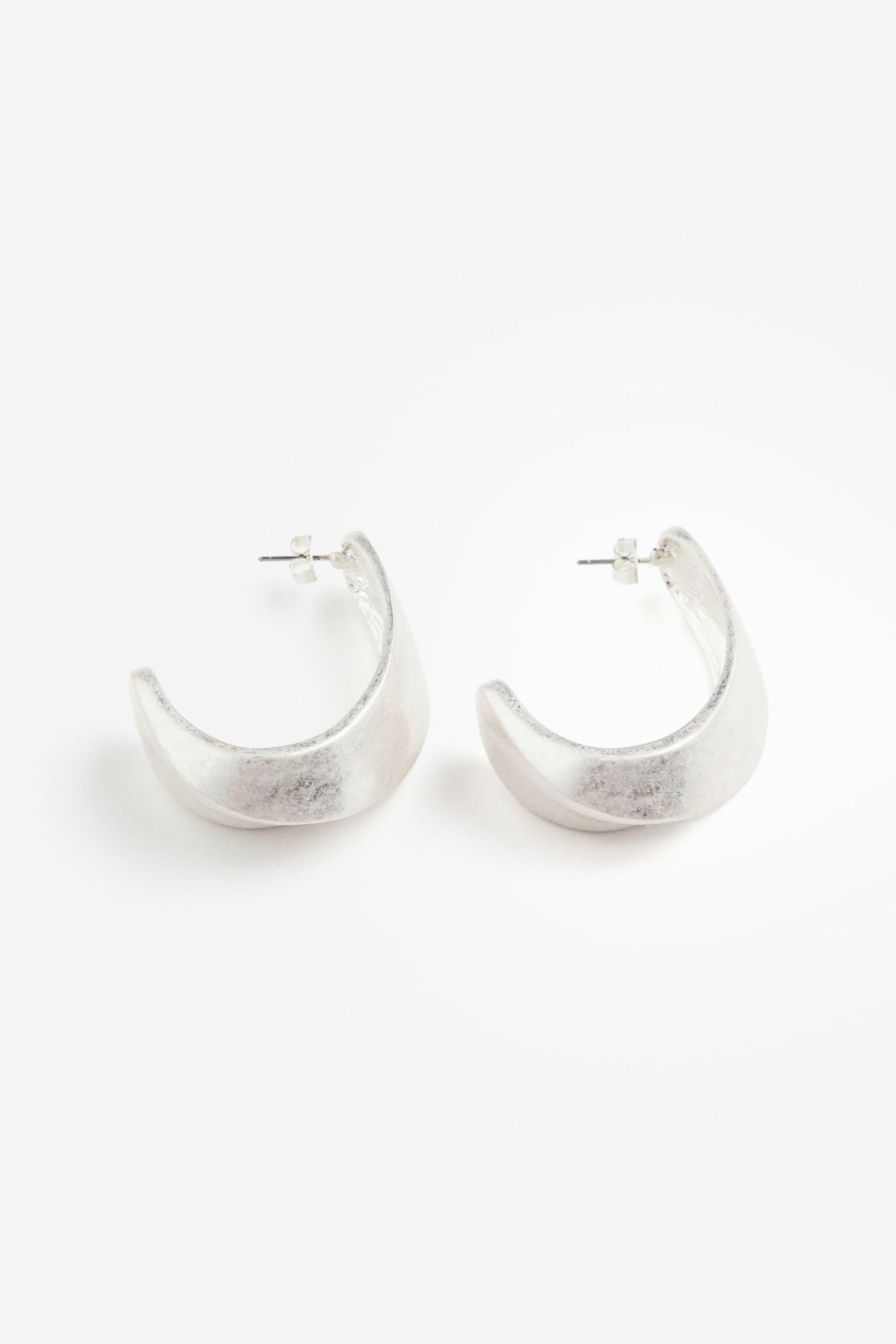 

Asymmetric hoop earrings