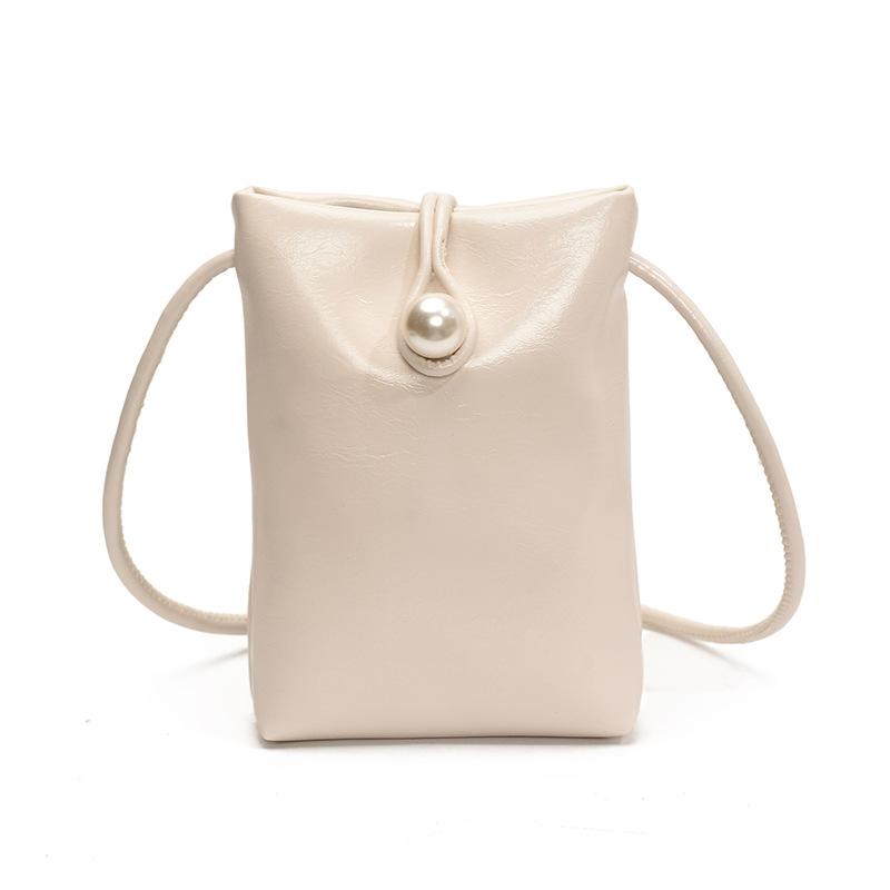 

Foreign style simple key pearl buckle bucket bag French style 2025 spring and summer new shoulder messenger mobile phone bag female білий